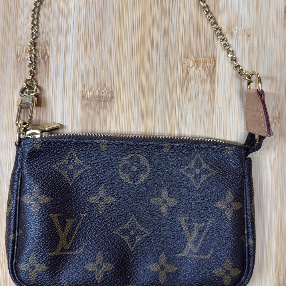 Louis Vuitton Black and Gold Monogram Wristlet